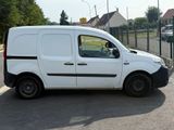a white van that is parked on the side of the road