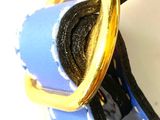 a close up of a blue and yellow dog collar with a gold buckle