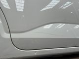 a close up of a car door handle and the door handle of the car