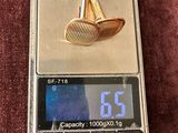 a small scale with a gold ring on top of it
