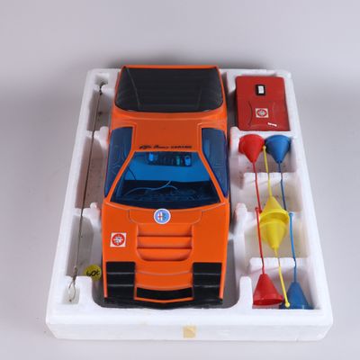 an orange toy truck with a blue top and a red and white truck