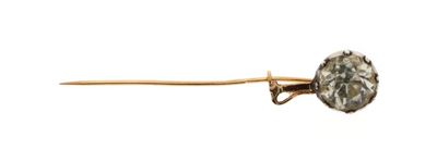 a gold pin with a diamond on it on a white background