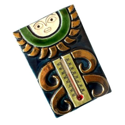 a thermometer with a picture of a sun on it