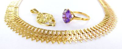 an image of a necklace, ring, and bracelet with a purple stone
