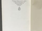 an open book with a drawing of a person on it