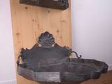 a black sink in the corner of a room