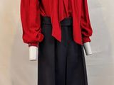 an image of a mannequin wearing a red shirt and black skirt