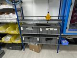 a room that has a lot of shelves and bins in it