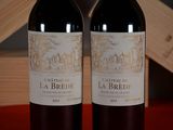 two bottles of wine that are sitting on a table