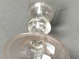 two empty wine glasses sitting on a table