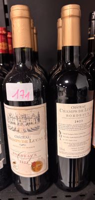 several bottles of wine are lined up on a shelf in a store