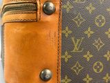 a close up of a louis vuitton bag with a zipper