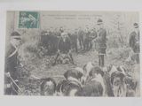 a picture of a postcard with a picture of a group of men and dogs