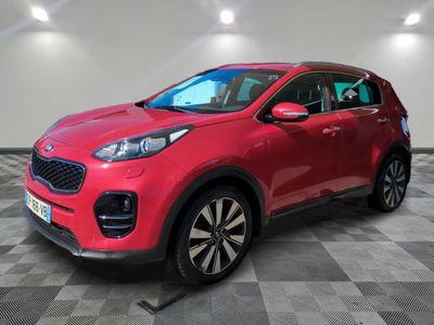 a red car parked in a garage with a checkered floor