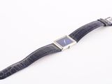 an image of a close up of a wrist watch on a white surface