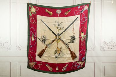 a picture of a wall hanging with two guns and a scarf