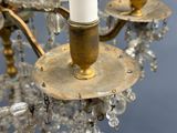 a close up of a chandelier with a candle on it