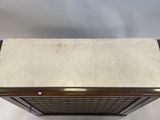 an art deco coffee table with a marble top and brass accents