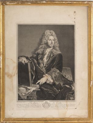 une vieille photo d'un homme aux cheveux longs, assis sur une chaise