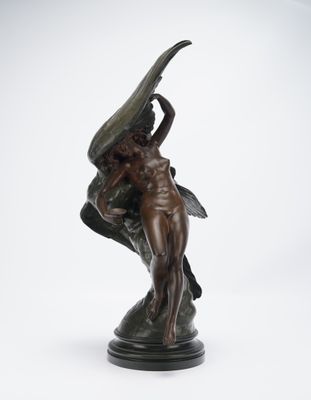 bronze statue of a woman holding a large fish on a pedestal