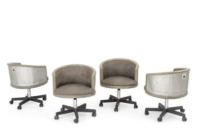 three chairs with wheels and a chair that has a seat on one of them