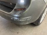 a close up of a car with a sticker on it ' s bumper