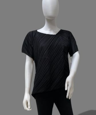 a white mannequin wearing a black top and black leggings
