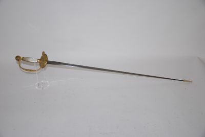 a sword that is sitting on a white surface