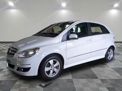 a picture of a white car parked in a garage