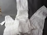 a white dress on a table next to a stack of books