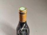 a bottle of wine that is sitting on a table