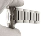 a person holding a watch in their hand
