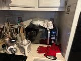 a kitchen with white cabinets and a black stove top oven