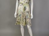 a mannequin wearing a dress with a floral print