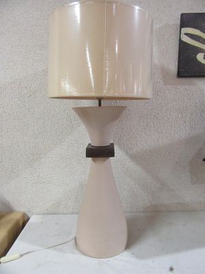 a lamp that is sitting on a table in a room