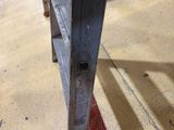 a close up of a metal rail in a parking garage