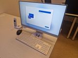 a desktop computer sitting on a desk with a keyboard and mouse
