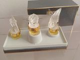 a glass display case with three glass figurines on it