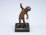 bronze figurine of a boy throwing a ball on a marble base