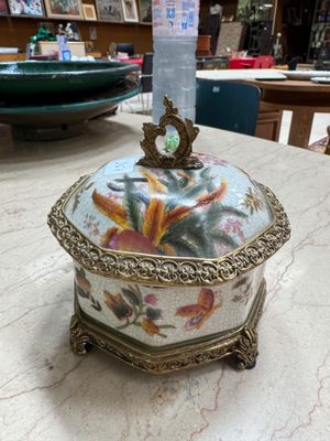 a decorative box sitting on a table in a room