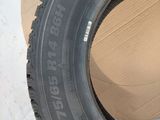 a close up of a tire on a cardboard box next to a cardboard box