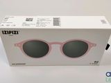 the box of a pair of sunglasses is sitting on the table