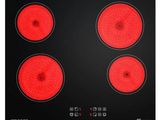 un gros plan sur une plaque de cuisson noire et rouge à quatre feux