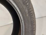 a close up of a tire on a white surface