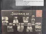 an old photo of a black wallet with a picture of paris on it