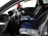 the interior of a car with black leather seats and a blue seat belt