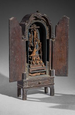 an image of a small wooden shrine with a statue in it