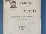 un vieux livre sur lequel figure le dessin d'un homme portant un chapeau