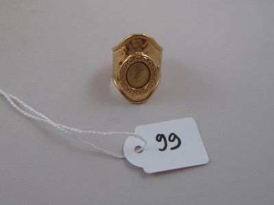 a small gold ring with a price tag attached to it