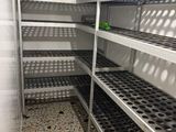 many shelves that are filled with food in the kitchen